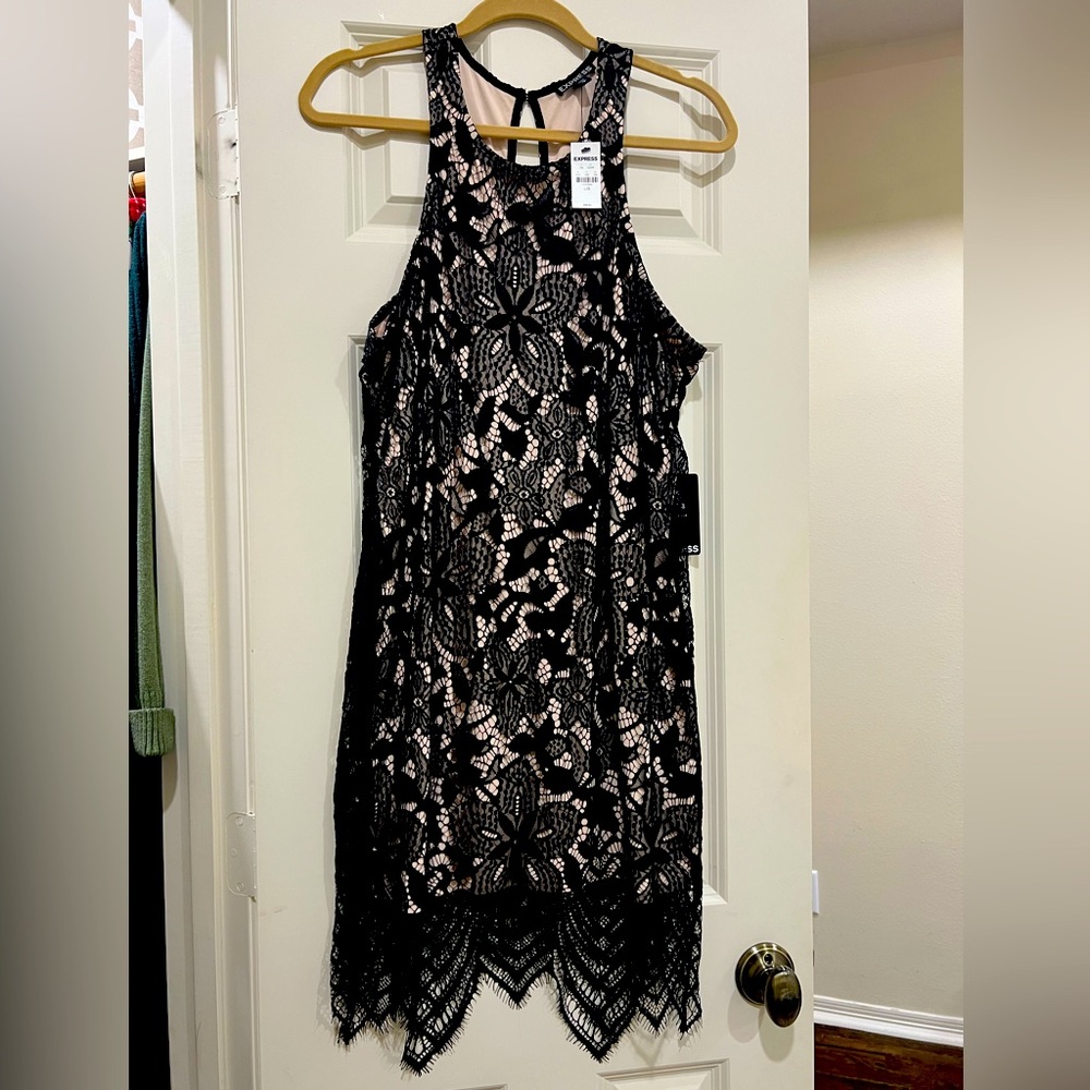 Black lace dress with nude underlay.
